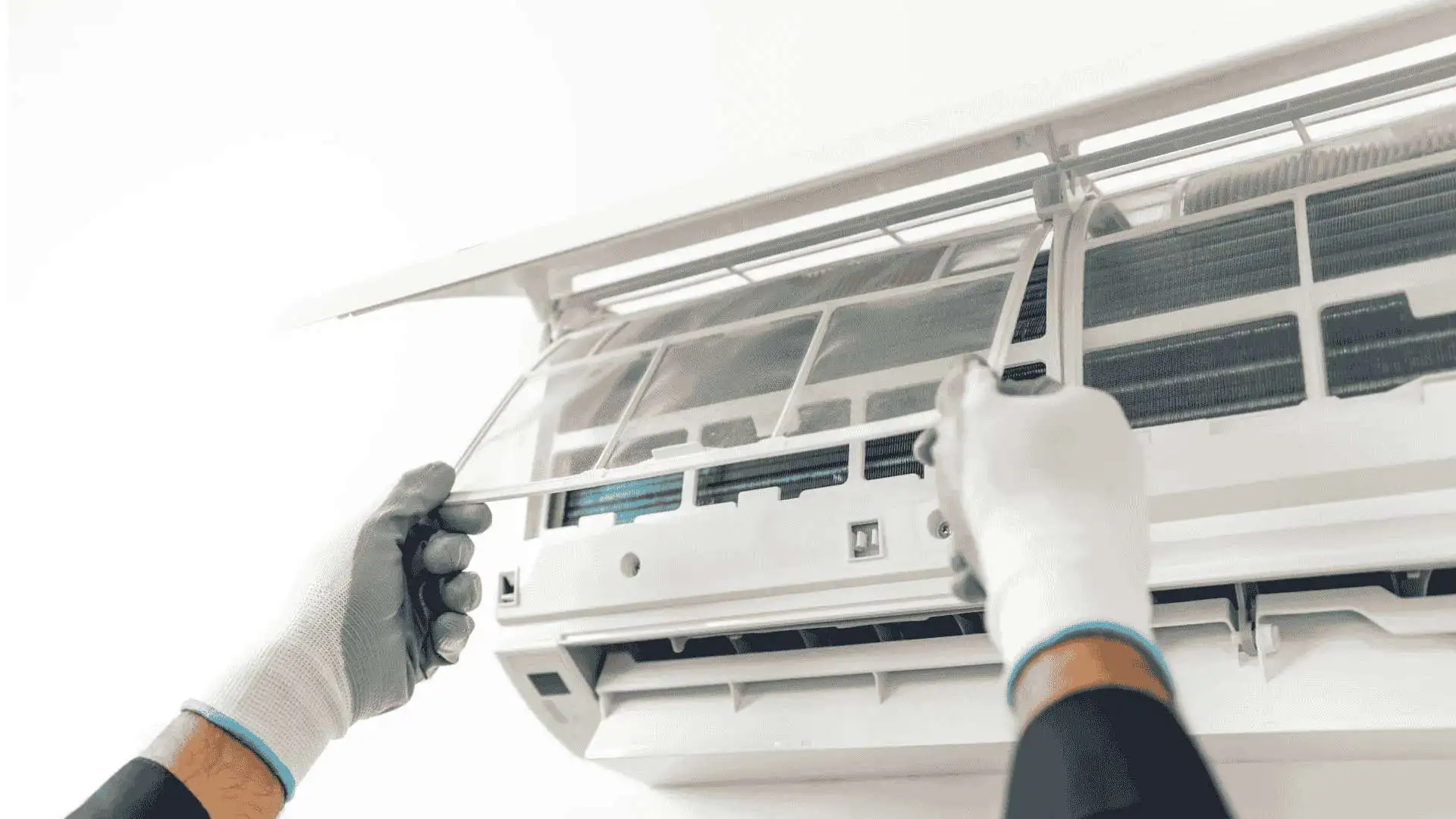 Professional AC repair technician servicing an air conditioning unit